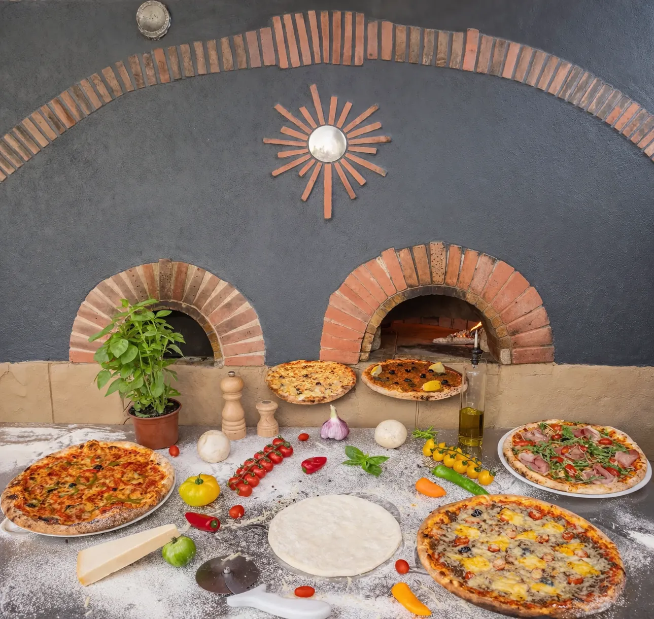 Le four a bois de Pizzeria Tivoli avec les pizzas en cuisson